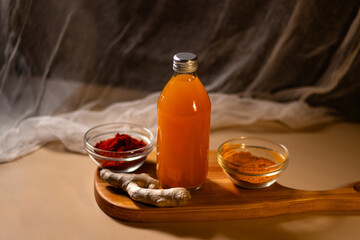 Homemade herbal drink in bottle. Cozy atmosphere for autumn evening. Concept of relax and didgital detox at home