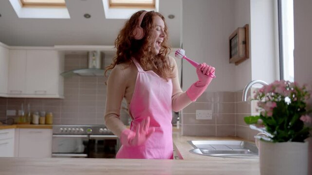 Exciting kitchen cleaning tips presented by a cheerful woman preparing for a tidy home