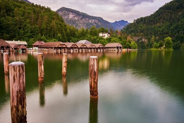Fototapeta premium Wooden Boathouses on a Serene Lake