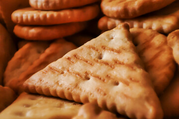 Close-up of assorted biscuits featuring a golden-brown color and detailed texture, perfect for food photography and culinary displays.
