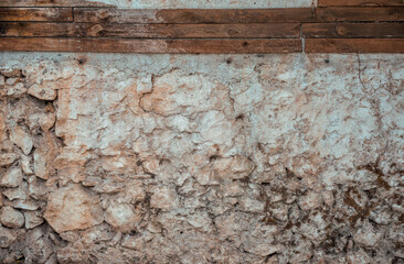 Historic wall made of rugged weathered stones