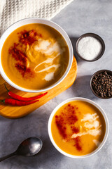Pumpkin soup flat lay. Cream soup with paprika and chili pepper. Vegetable soup for vegan. Healthy eating. Concept of resaturant cafe healthy eating