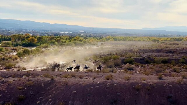 Scenic desert landscape of Wetlands Park in Las Vegas provides a stunning backdrop for a group of adventurous horseback riders, blending urban proximity with natural beauty and outdoor recreation.
