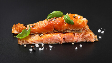 hot smoked salmon fillet on black background