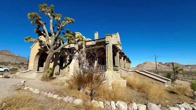 Abandoned historic train station depot in Rhyolite ghost town stands as a silent sentinel near Death Valley, embodying the bygone era of frontier expansion and fleeting prosperity. 