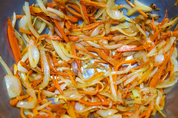 stir-fried the slices of onion and carrot