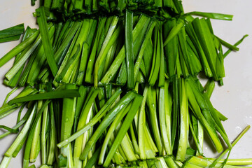 knife-cut chives on the cutting board
