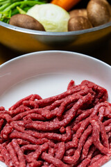 uncooked beef and fresh vegetables