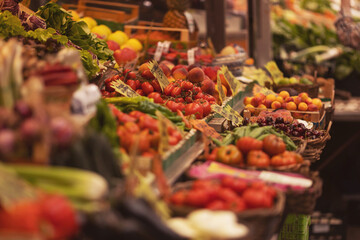 Fresh cherry tomatoes and vegetables on farmers market stall. Vegetable on the market counter. 