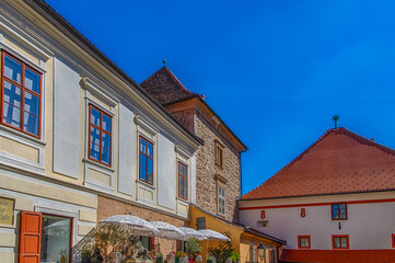 Historic street and Stone gate on Upper town in Zagreb, capital of Croatia with beautiful stone statue of lion.