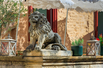Historic street and Stone gate on Upper town in Zagreb, capital of Croatia with beautiful stone statue of lion.