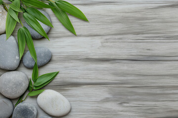 Wellness Background Featuring Bamboo Leaves and Stones on Rustic Wood