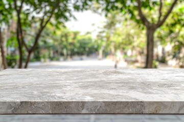 Empty marble stone table top with blurred park in background, showcasing a tranquil setting ideal for product placement or design presentations
