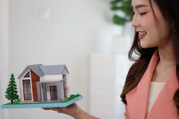 A home sales representative who is recommending a home to customers online with a home demo.