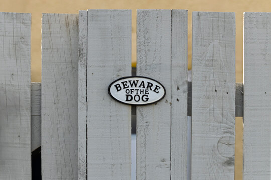 White Wooden Plank Garden Gate with Metal Beware of Dog Sign