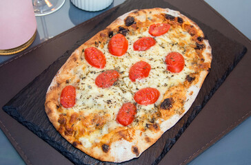 Table set with pizza. Table prepared for lunch or dinner with food. Pizza party time. Fast food lunch. Celebration time.