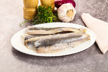 Marinated salted herring fillet apetizer