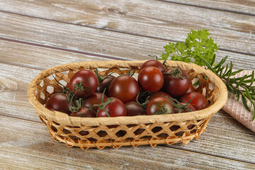 Juicy ripe black cherry tomato
