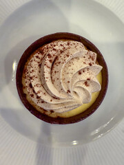 Small Cream, Coffee, And Chocolate Dessert On A White Plate