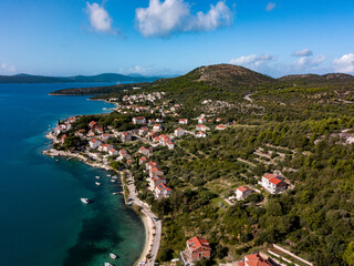 Stunning aerial shot of a Croatian coastal town with a clear blue sea