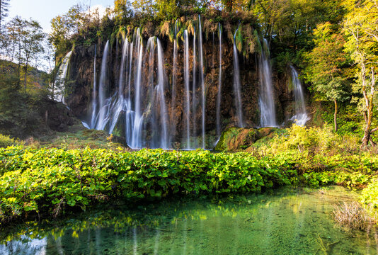 Majestic Waterfall A stunning waterfall with multiple cascades flowing down a rocky cliff