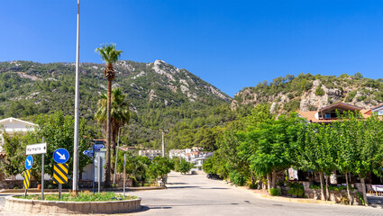 Road in village Turunс, neighbourhood of municipality and district Marmaris, Mugla Province, Turkey. Holiday resort on Mediterranean Sea coast. Taurus Mountains