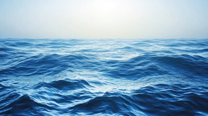 Fototapeta premium Calm ocean waves under a bright sky with a soft horizon Copy Space