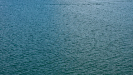 Sea water surface. Ripple water of ocean. Aquamarine ocean nature. Background of clear turquoise sea water. Idyllic summer vacation. Caribbean sea. Aerial view. Rippled surface