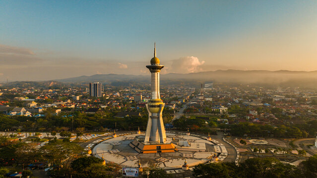 Aerial photo of the religious monument which is one of the icons in Kendari, Southeast Sulawesi, Indonesia at sunset. Panoramic view around the monument with residential and urban background at dusk