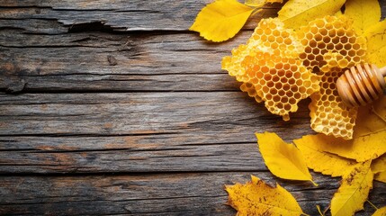 Honeycomb and autumn leaves on rustic wooden surface with ample space for customization and design applications