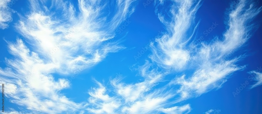 Aufkleber Serene bright blue sky with wispy white clouds creating a tranquil backdrop with ample empty space for text and design elements