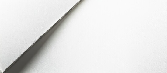 Blank hardcover book placed diagonally on a white background featuring soft shadows and ample space for personalized text or designs