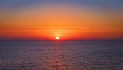 멀리 수평선 위로 떠오르는 선명한 일출, 붉고 따뜻한 색감의 태양