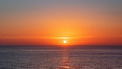 Fototapeta premium 멀리 수평선 위로 떠오르는 선명한 일출, 붉고 따뜻한 색감의 태양