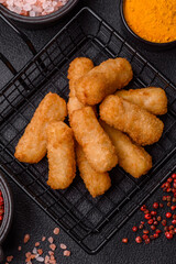 Delicious crispy cheese sticks with mozzarella, salt and spices
