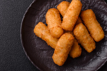 Delicious crispy cheese sticks with mozzarella, salt and spices
