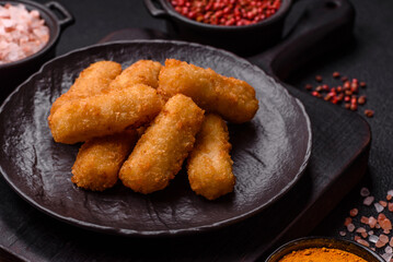 Delicious crispy cheese sticks with mozzarella, salt and spices