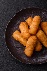 Delicious crispy cheese sticks with mozzarella, salt and spices
