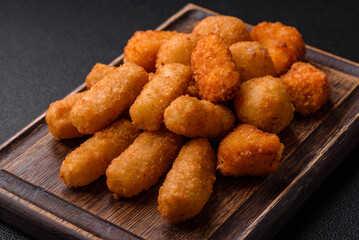 Delicious crispy cheese sticks with mozzarella, salt and spices