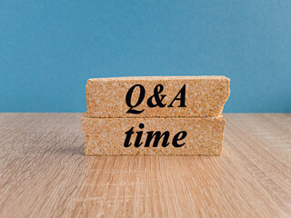 Q and A, questions and answers time symbol. Concept words 'Q and A time' on brick blocks on a...