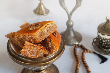 Close up of a delicious traditional Turkish Ramadan dessert Baklava served with syrup in a tray. with copy space image. Place for adding text or design