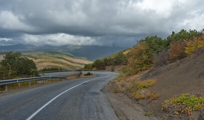 Russia, Republic of Crimea. View of the winding paved road along the Black Sea coast near the town...