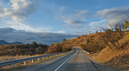 Russia, Republic of Crimea. View of the winding paved road along the Black Sea coast near the town...