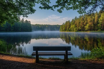 Obraz premium Bench in park with view on the lake in the morning