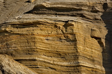 Russia. The Far East. The Kuril Islands. Textures of crumbling coastal rocks of Iturup Island, exposed to salt water, wind and sun.