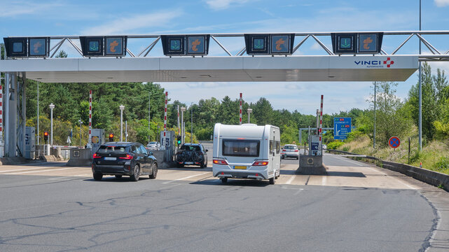 Toll gates somewhere in the South of France with the t T&eacute;l&eacute;p&eacute;age logo or sign. Telepeage is a means of rapid toll payment on French motorways with a sender box in the car.