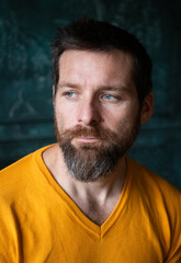 Fototapeta premium handsome man portrait on a dark background