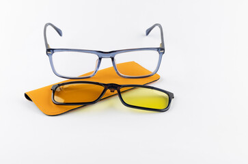 Yellow glasses on a white background, dedicated glasses for drivers, driving at night with glasses