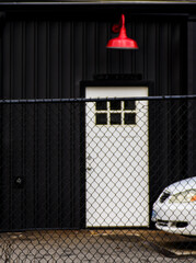 Red lamp over white door