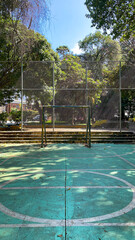 Abandoned Futsal Court with Overgrown Vegetation